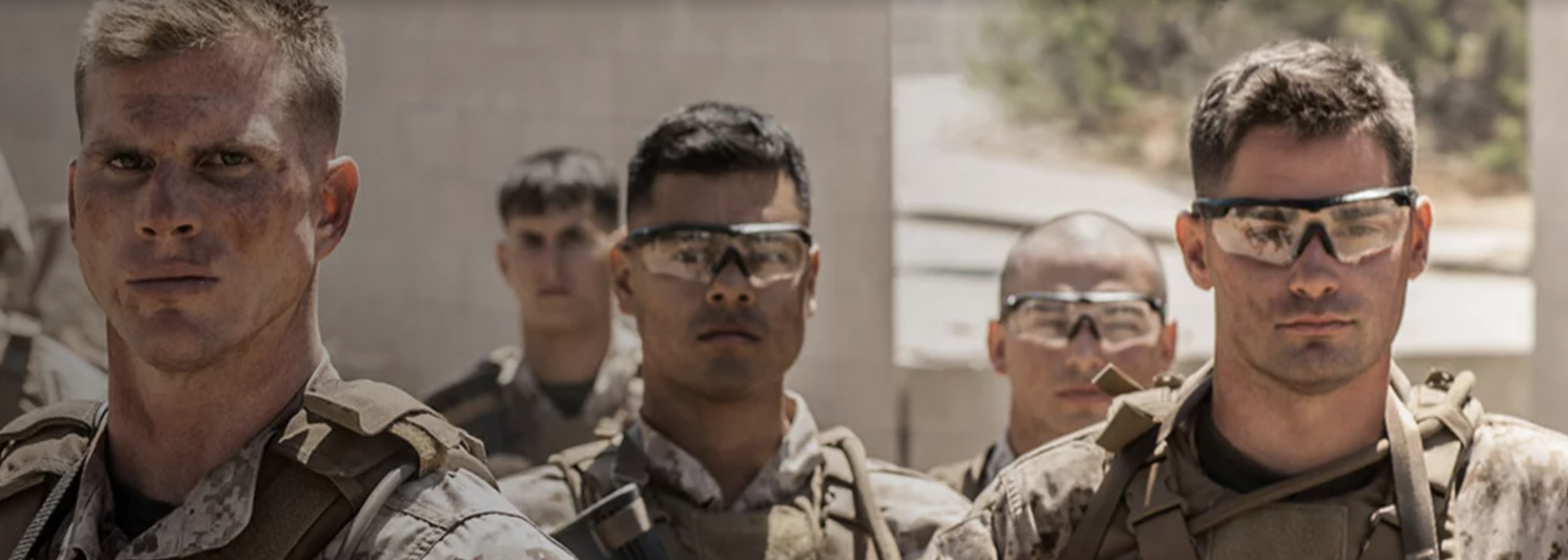 Group of marine enlisted soldiers dressed in camouflage uniform