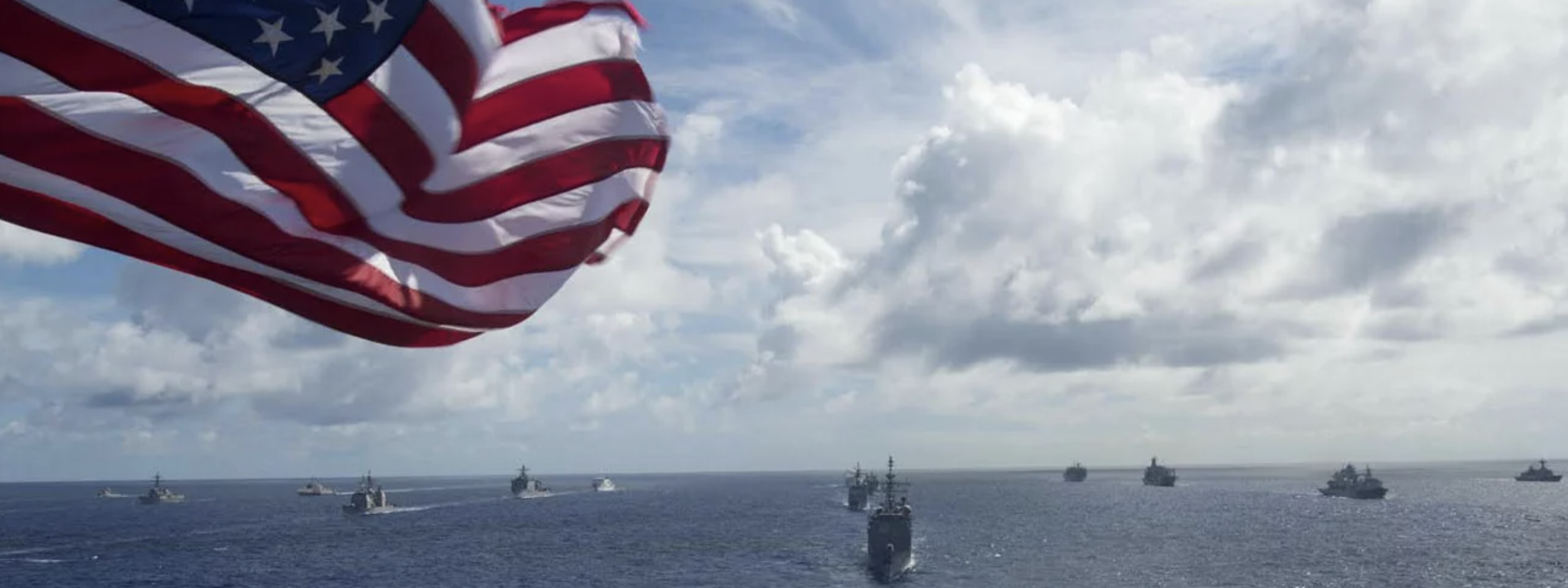 Battleships at sea with american flag